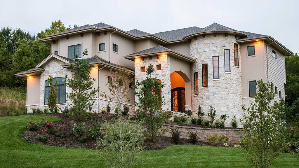 European inspired residential home with cassidy natural stone veneer