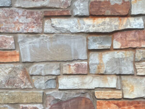 closeup of chilton cambrian natural stone veneer display with standard grey mortar