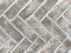 Doverton Gray Clay Brick Herringbone on mesh shown with white mortar