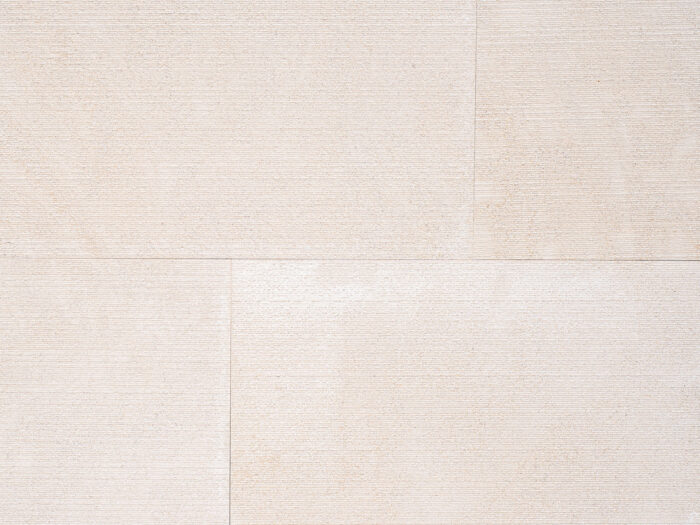 Closeup of AllClad Dune Linear Rake natural stone tile product