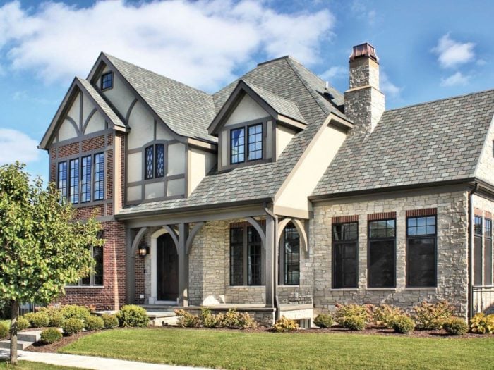 tudor home with fond du lac neutral colored stone veneer on exterior
