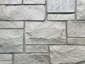 closeup of sussex grey castle rock natural stone veneer display with standard grey mortar