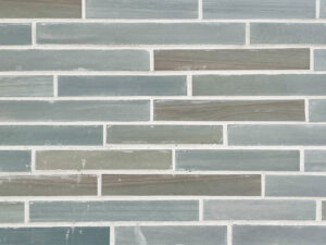 closeup of bluestone thin brick natural stone veneer display with white mortar