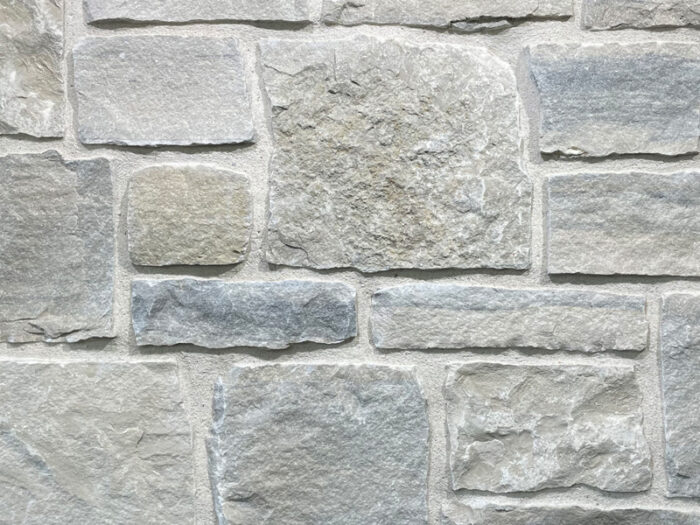 closeup of breakwater cottage natural stone veneer display with white mortar