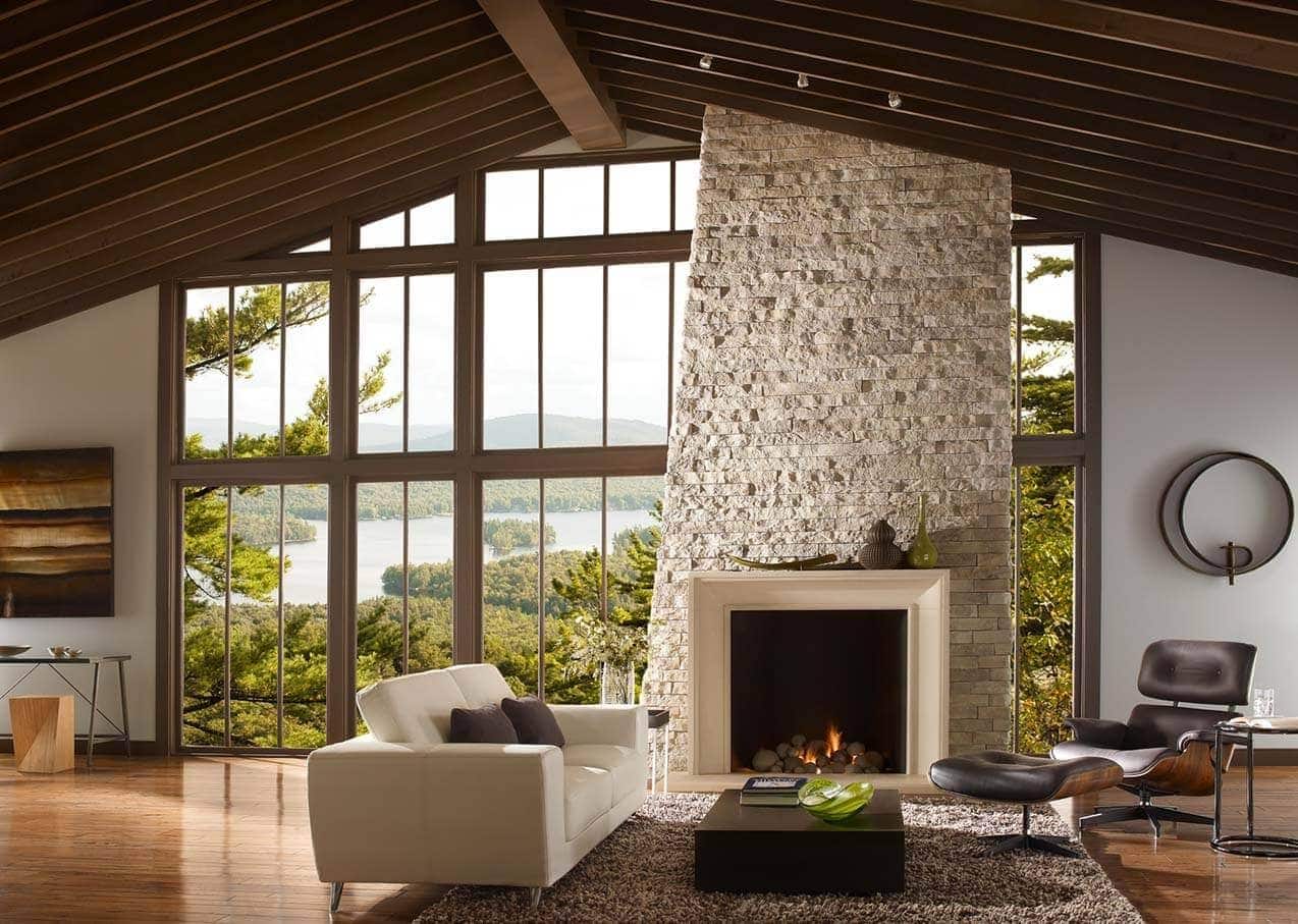 modern living room with a massive stone fireplace and cast stone surround