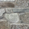 closeup of castle mountain natural stone veneer display with standard gray mortar
