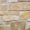 closeup of chestnut ashlar natural stone veneer display with standard grey mortar