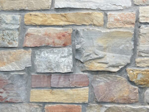 closeup of chilton cambrian natural stone veneer display with standard grey mortar