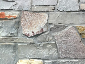 closeup of chilton heritage natural stone veneer display with standard gray mortar