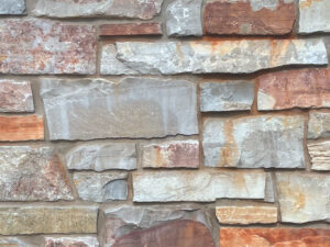 closeup of chilton rustic natural stone veneer display with standard grey mortar