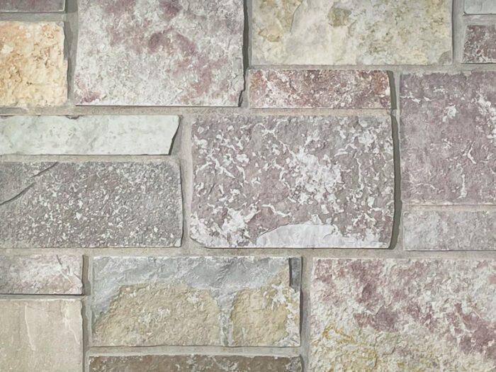 closeup of chilton tailored blend natural stone veneer display with standard grey mortar