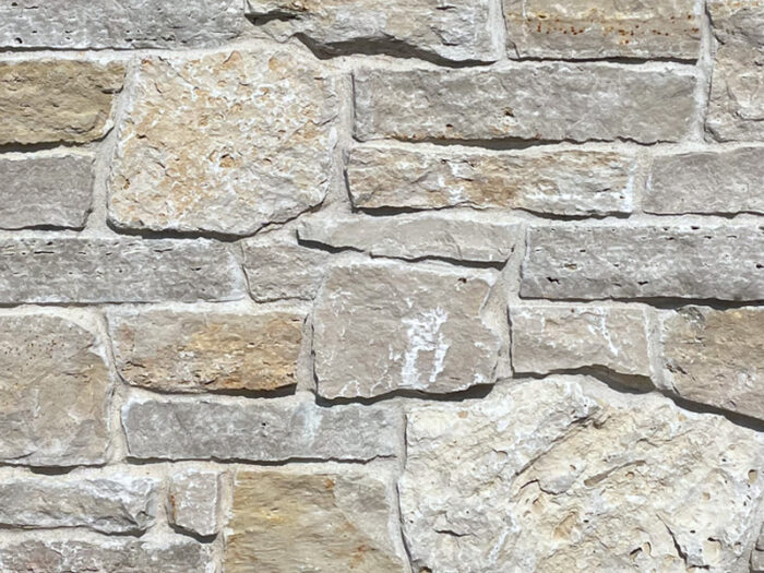closeup of cotswold croft natural stone veneer display with white mortar