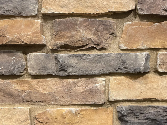 closeup of coyote ridge manufactured stone veneer display with buff mortar