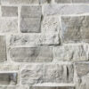 closeup of door county farmhouse natural stone veneer display with white mortar