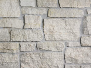 closeup of fond du lac country squire natural stone veneer display with standard grey mortar