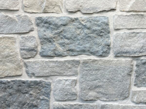 closeup of glenwood point natural stone veneer display with white mortar