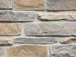 closeup of grizzly pass ridge manufactured stone veneer display with restoration mortar