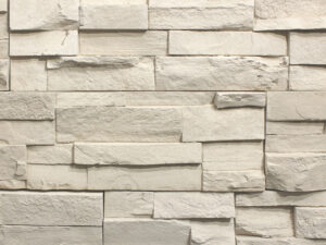 closeup of harvest white urban ledge manufactured stone veneer display drystacked without mortar