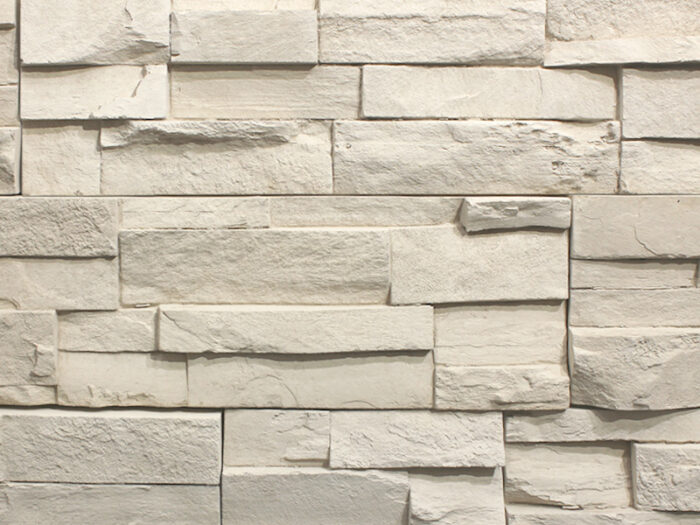 closeup of harvest white urban ledge manufactured stone veneer display drystacked without mortar
