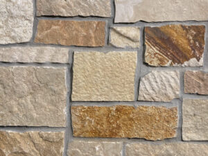 closeup of highland brown natural stone veneer display with standard grey mortar