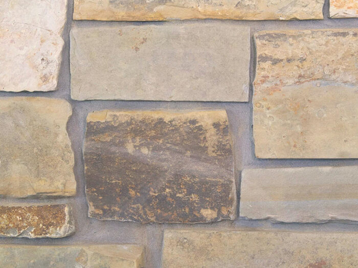 closeup of highlands ledge natural stone veneer display with standard grey mortar