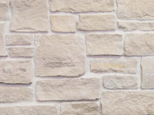 closeup of jute cloth country squire natural stone veneer display with white mortar