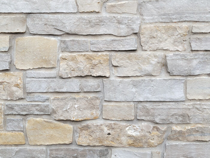 closeup of kentucky run natural stone veneer display with white mortar