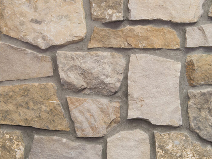 closeup of leventina natural stone veneer showroom display with standard grey mortar