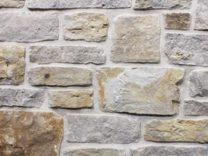closeup of maple tree mill natural stone veneer display with white mortar