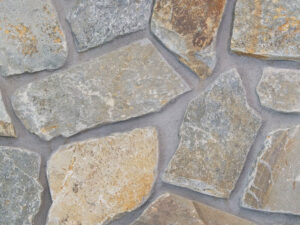 closeup of mcgregor lake cottage natural stone veneer display with standard grey mortar