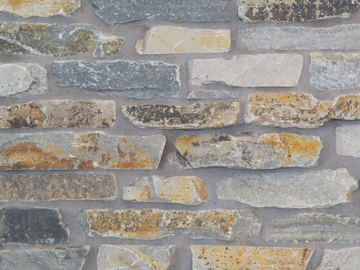 closeup of mcgregor lake stack natural stone veneer display with standard grey mortar