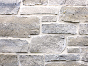 closeup of meadows farm natural stone veneer display with white mortar