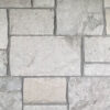 closeup of middleton castle natural stone veneer display with standard grey mortar