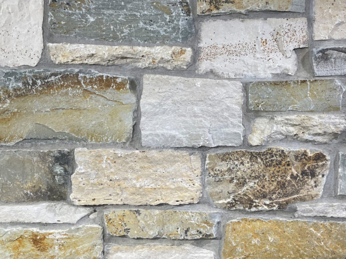 closeup of minnehaha natural stone veneer display with standard grey mortar
