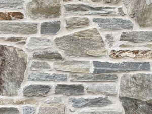 closeup of Misty Harbor natural stone veneer display with white mortar