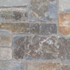 closeup of moose mountain ledge natural stone veneer display with standard grey mortar