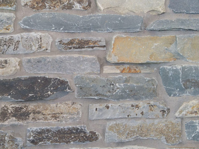 closeup of moose mountain stack natural stone veneer display with standard grey mortar