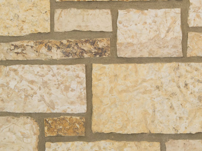 closeup of natural strata natural stone veneer display with buff mortar