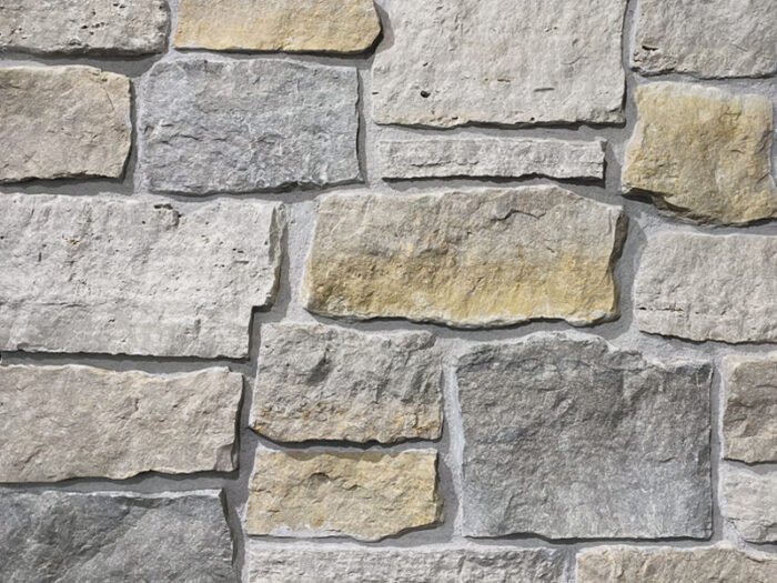 closeup of pinecone path natural stone veneer display with restoration mortar