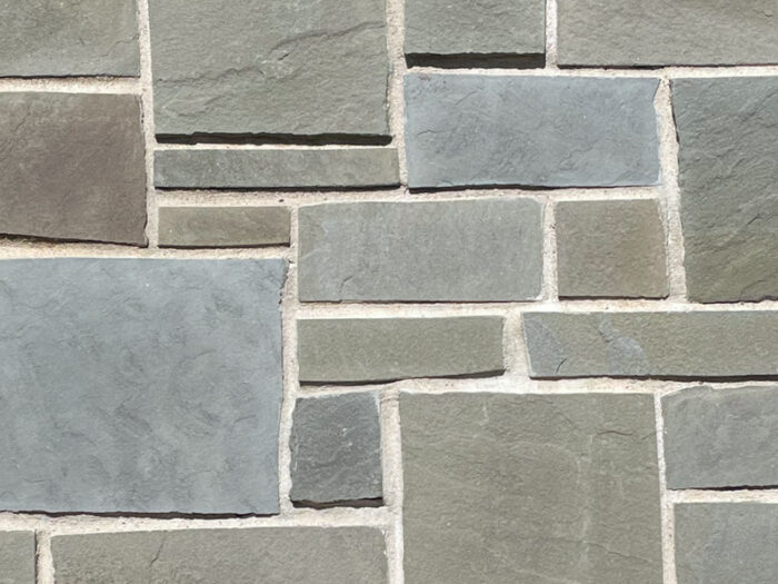 closeup of potomac castle rock natural stone veneer display with white mortar