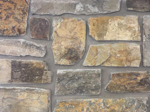 closeup of prichard chiefcliffe natural stone veneer display with standard gray mortar