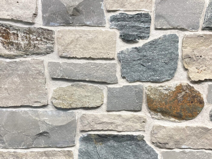 closeup of sandpiper cove natural stone veneer display with white mortar