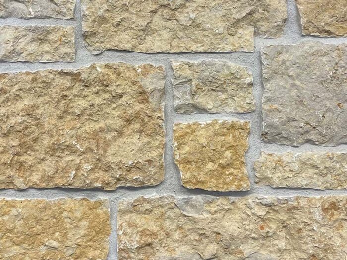 closeup of sandy bay bedface natural stone veneer display with restoration mortar