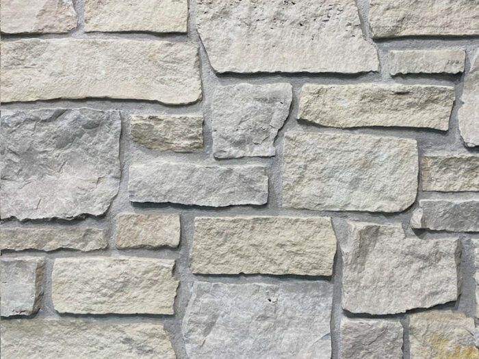 closeup of seashell cottage natural stone veneer display with restoration mortar