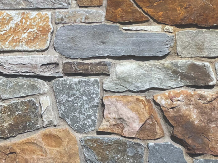 closeup of sherwood forest natural stone veneer display with standard gray mortar