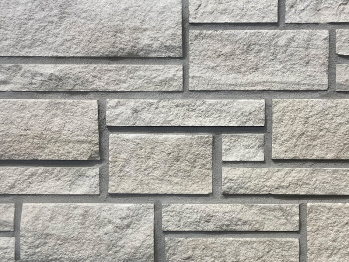 closeup of silver shadow natural stone veneer display with standard grey mortar