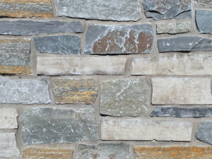 closeup of sterling pass two natural stone veneer display with standard gray mortar