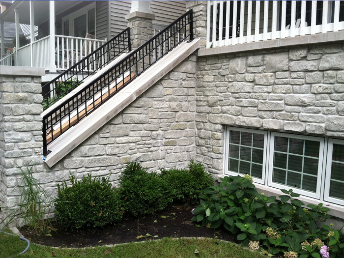 close up of the first floor of a home sided in stone harbor tumbled thin stone veneer