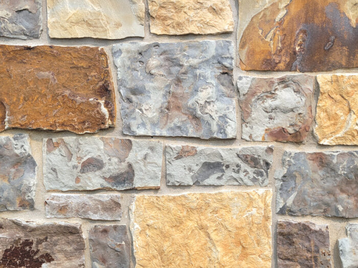 closeup of tamarack mountain natural stone veneer display with standard grey mortar