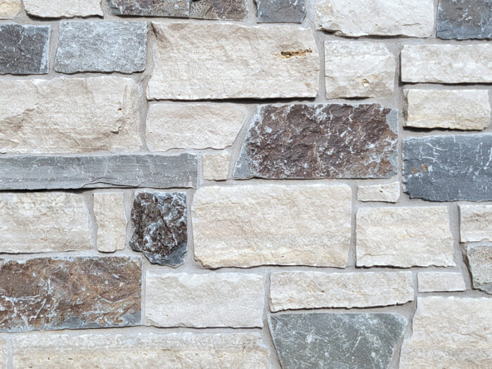 closeup of timber hills natural stone veneer display with standard grey mortar